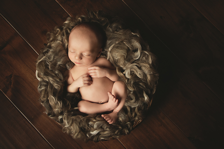 blackfalds newborn photographer, newborn in basket , earthy newborn photo, newborn photoshoot, red deer newborn photographer