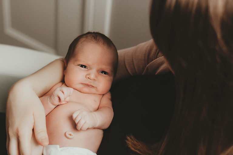 Red Deer lifestyle photographer, lifestyle newborn photos, family in nursery