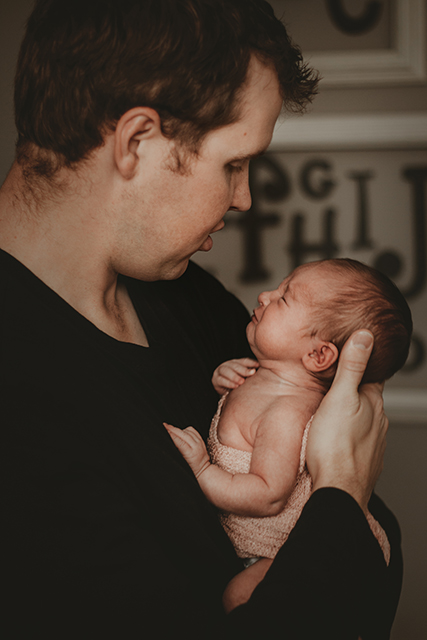 Red Deer lifestyle photographer, lifestyle newborn photos, family in nursery